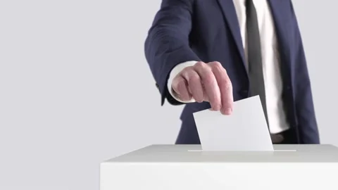Voting. Man Putting a Ballot into a Voting Box With Space for Text or Logo. Stock Footage 179899884