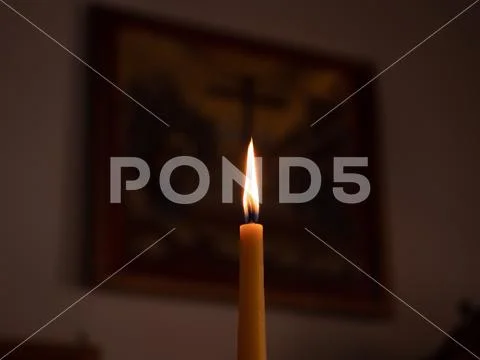 Votive candles alight in Church Stock Photos