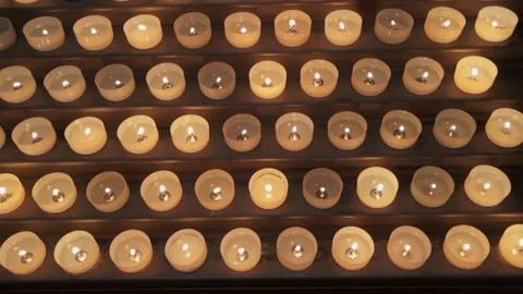 Votive candles with flames Stock Footage 238412904