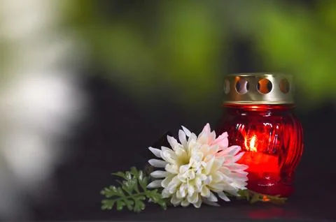 Votive grave candle lantern and flower Stock Photos