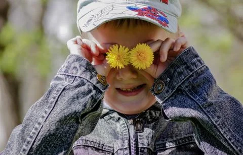 Вoy with dandelions Stock Photos