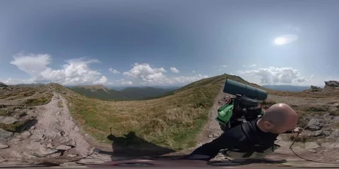 Vr 360 Backpacker walking alone in mountains 2pt. Stock Footage 94714416