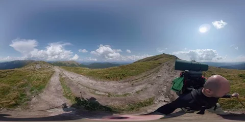 Vr 360 Backpacker walking alone in mountains. 1pt. Stock Footage 94714606