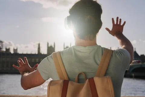 Vr, 3d and back of man in city exploring metaverse, cyber ai or future virtual Stock Photos