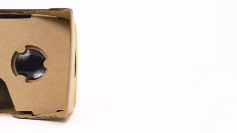 VR cardboard glasses on the table. Dolly shot. Video stock 88925730