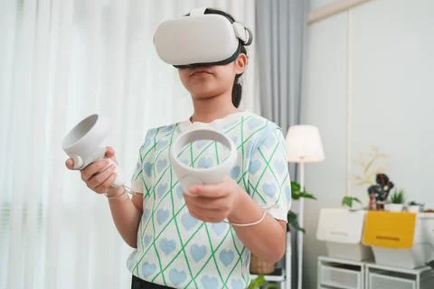 VR for edutainment. Child learning through interactive gaming and simulation. Stock Photos