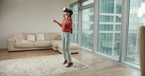 Vr first reaction , close-up of a young Asian girl surprised in the glasses of Stock Footage 74091189