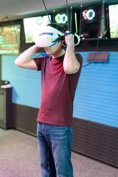Vr game and virtual reality. man gamer fun playing on futuristic simulation v Stock Photos
