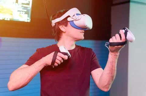 Vr game and virtual reality. man gamer fun playing on futuristic simulation v Stock-Fotos