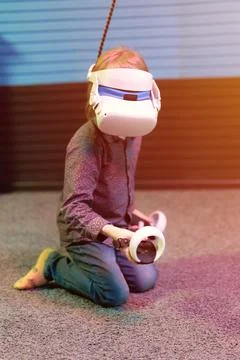 Vr game and virtual reality. kid boy gamer six years old fun playing on futur Stock Photos
