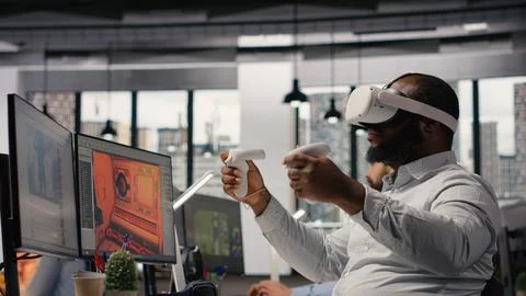 VR glasses cyberspace, game developer, video game in space, dual monitors Stock Photos