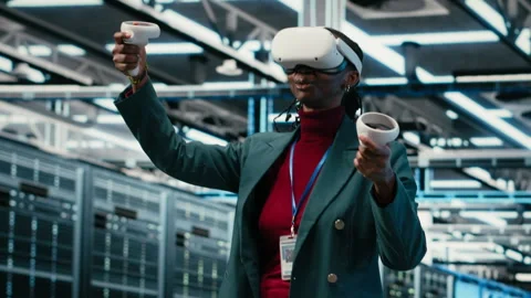 VR headset gear, AR simulation and system administrator in data center Stock Footage 329530957
