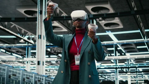 VR headset gear, AR simulation and system administrator in data center Stock Footage 329532403