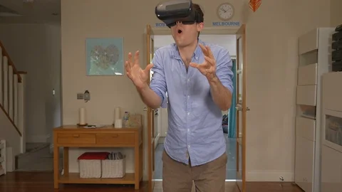 VR headset man caught cheating at home with virtual Stock Footage 89921225