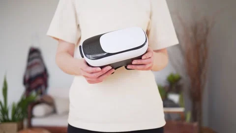 VR headset in women's hands close up. Virtual reality technology Stock Footage 148208163