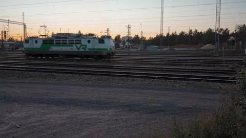VR locomotive entering train yard in evening, Kouvola, Finland Stock Footage 345661468