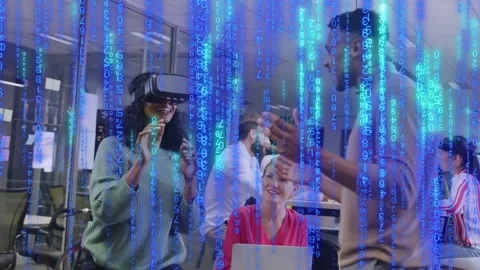 VR user activating headset man demoing laptop user watching blue code overlay Stock Footage 334372543
