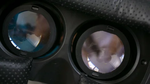 VR virtual reality glasses inside interior, dutch angle tilt shot, playing games 库存影片 93643402