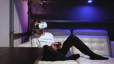 VR Virtual reality headset goggles metaverse session dissapointed bored Stock Footage 167559167