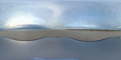 VR360, Car drives over sandy beach on the North Sea, VR Stock Footage 117537051