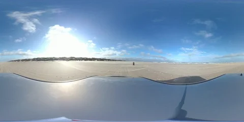 VR360, Car drives over sandy beach during storm on the North Sea, VR Stock Footage 117537552