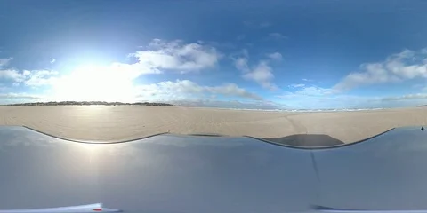 VR360, Car drives over sandy beach during storm on the North Sea, VR Stock Footage 117537736