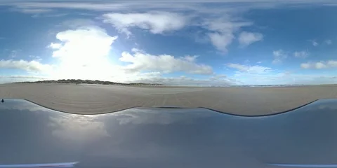 VR360, Car drives over sandy beach during storm on the North Sea, VR Stock Footage 117537930