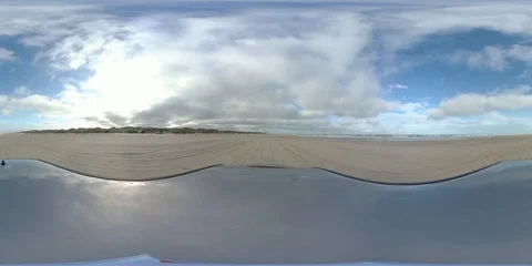 VR360, Car drives over sandy beach during storm on the North Sea, VR Stock Footage 117538139