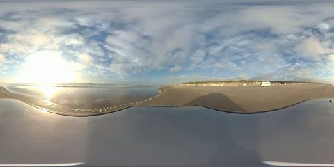 VR360, Car drives over sandy beach by sunset, North Sea, VR Stock Footage 117538244