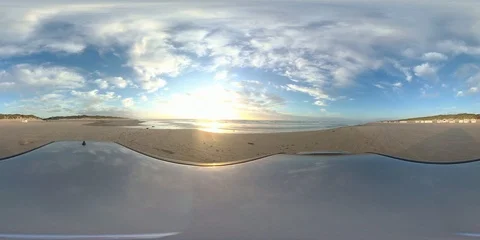 VR360, Car drives over sandy beach by sunset, North Sea, VR Stock Footage 117538313