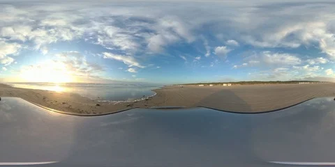 VR360, Car drives over sandy beach by sunset, North Sea, VR Stock Footage 117538472