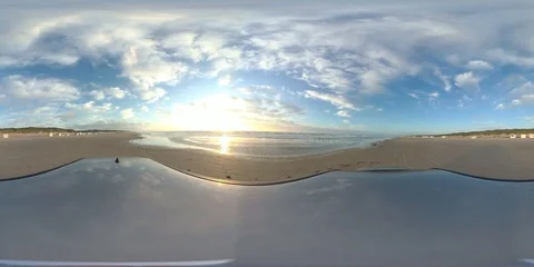 VR360, Car drives over sandy beach by sunset, North Sea, VR Stock Footage 117538987