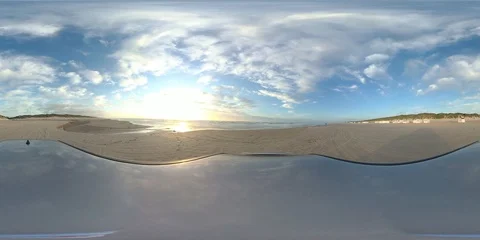 VR360, Car drives over sandy beach by sunset, North Sea, VR Stock Footage 117539189