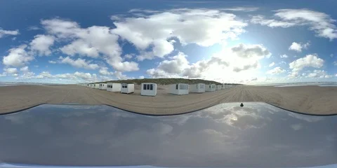 VR360, Car drives over sandy beach with bath houses, North Sea, VR Stock Footage 117539397