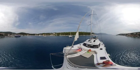 VR360 Catamaran sailing in a sunny summer day view from the bow, with people rel Stock Footage 120787425