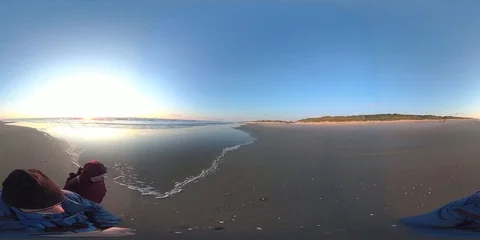 VR360, Couple on the beach by sunset, North Sea, VR Stock Footage 117715101