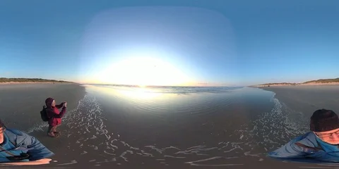 VR360, Couple on the beach by sunset, North Sea, VR Stock Footage 117715653