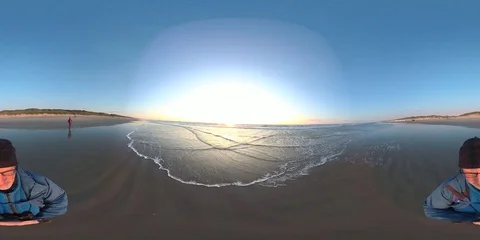 VR360, Couple on the beach by sunset, North Sea, VR Stock Footage 117715756