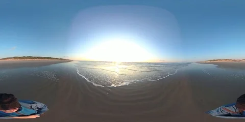 VR360, Couple on the beach by sunset, North Sea, VR Stock Footage 117716071