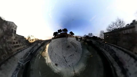 VR360 Effect Rome, A man ride a Bike along the river on Tiberina Island at Dusk Stock Footage 100315922