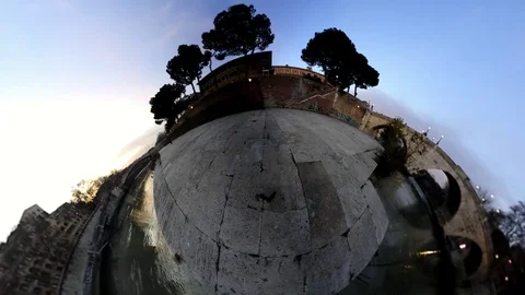 VR360 Effect Rome, A man ride a Bike along the river on Tiberina Island at Dusk Stock Footage 100315965