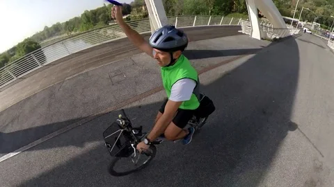 VR360 effect  Rome, a man rides a bike in a  sunny morning on the modern bridge  Stock Footage 107135566