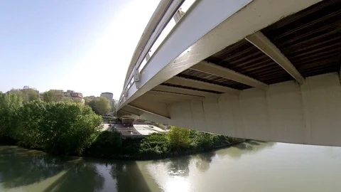VR360 effect  Rome, a man rides a bike in a  sunny morning on the modern bridge Stock Footage 107135923