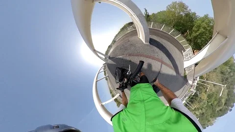 VR360 effect  Rome, a man rides a bike in a  sunny morning on the modern bridge Stock Footage 107444597