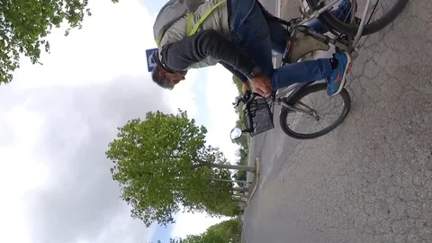 VR360 effect, Rome a man rides a bike in a suburban area, cloudy day, vertical Stock Footage 107600899