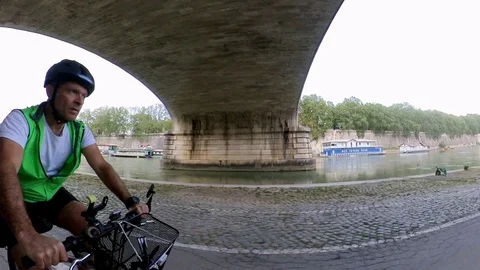 VR360 effect Rome, Riding a bike along the river bicycle lane, under the bridge Stock Footage 107135748