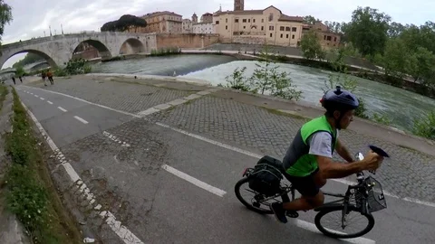 VR360 effect Rome, Riding a bike along the river bicycle lane, Tiberina Island Stock Footage 107135786