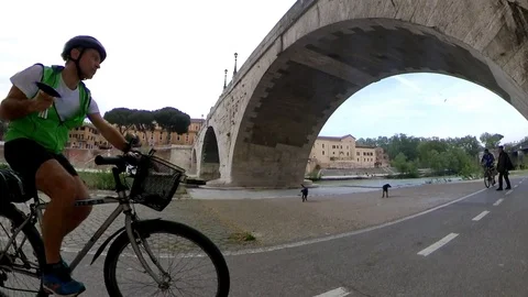 VR360 effect Rome, Riding a bike along the river bicycle lane, Tiberina Island Stock Footage 107135817
