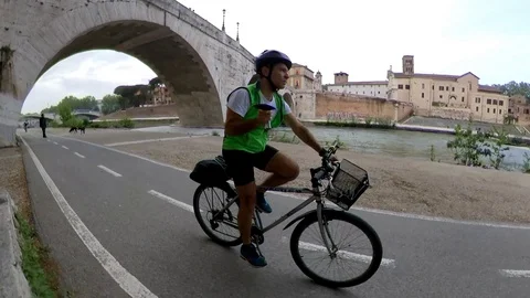 VR360 effect Rome, Riding a bike along the river bicycle lane, Tiberina Island Stock Footage 107136188