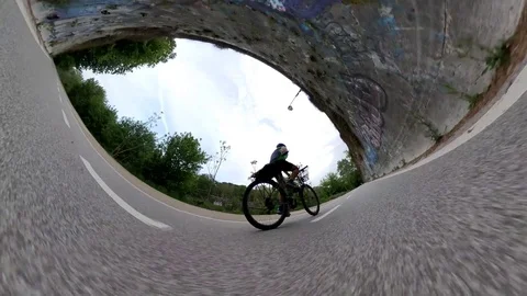 VR360 Extreme POV effect A biker rides on the bicycle lane Along the river Rome Stock Footage 107136057